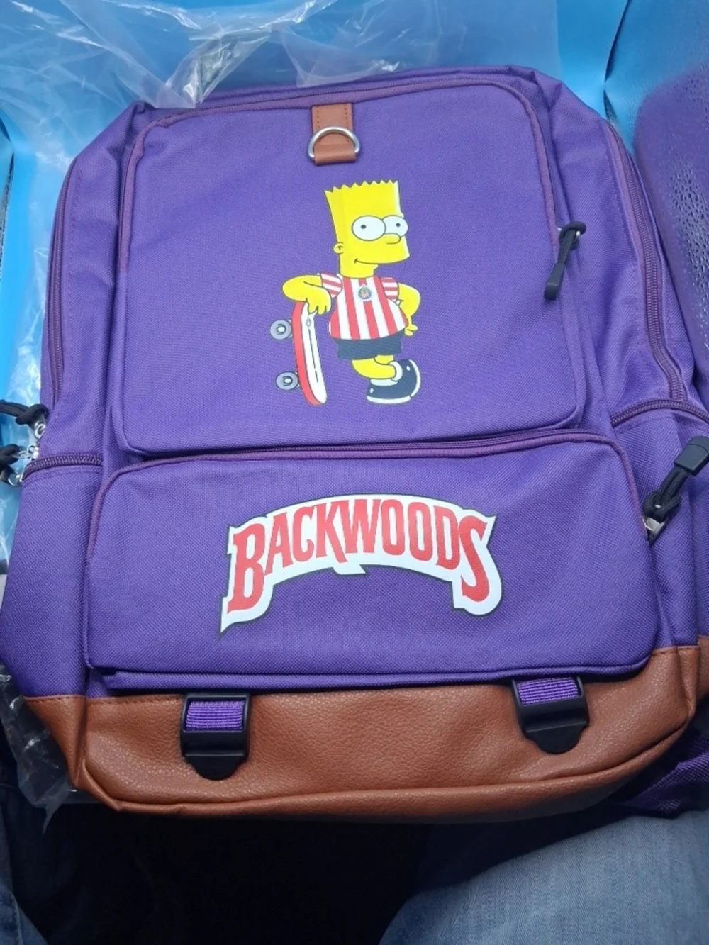Purple Backpack with Brown Trim and Skate Graphic